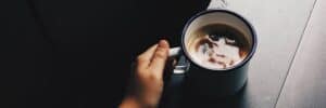 holding-mug-of-coffee