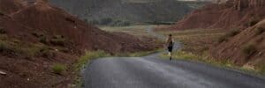 Woman-Jogging-in-Scenic-Road