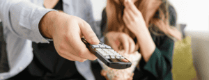 Man-Holding-Remote-Control
